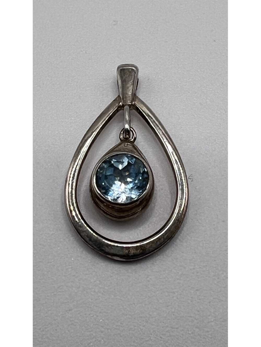 Silver Teardrop Pendant with Faceted Sky Blue Stone – 1.25”
